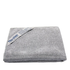 Norwex paños junto a objeto para comparar tamaño y utilidad