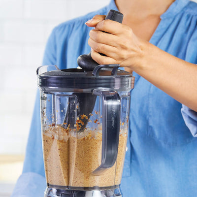 NutriBullet blending mixed berries in pitcher showing smooth texture and quick processing