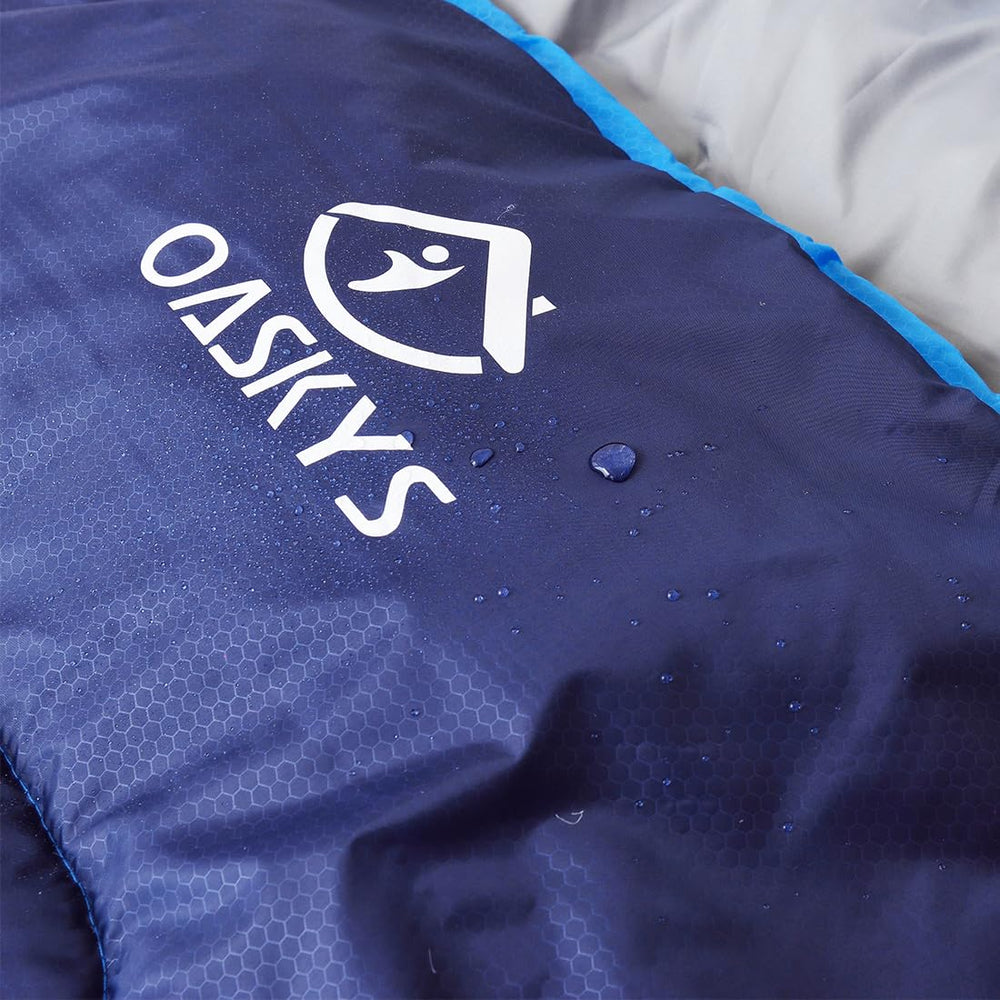 oaskys sleeping bag beside backpack showing size and packing convenience benefit