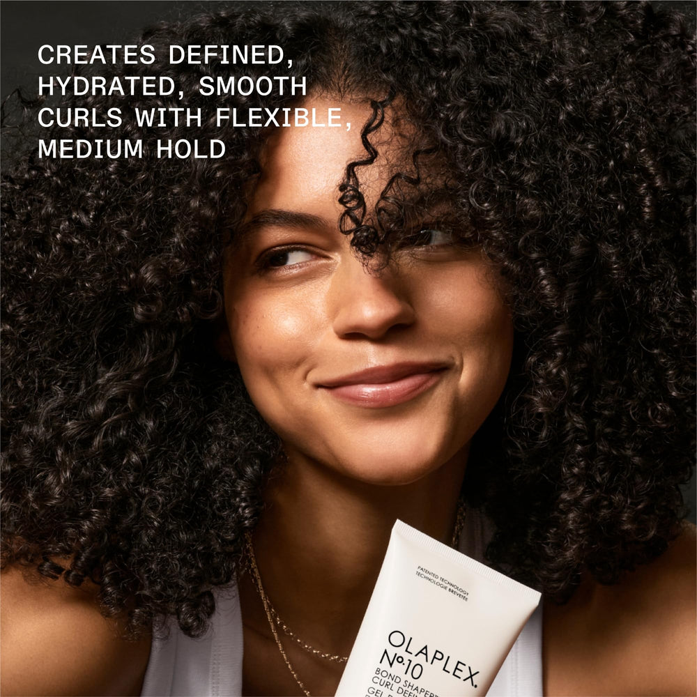 Coconut and avocado ingredients near Olaplex No.10 illustrating nourishment benefits