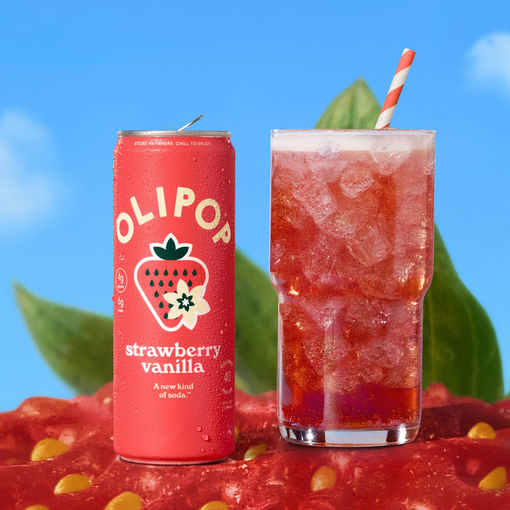 OLIPOP lata en mano mostrando tamaño y portabilidad