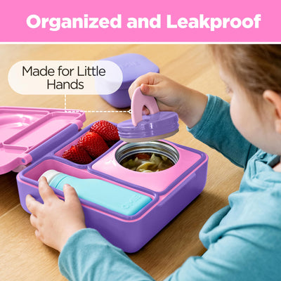Omie OmieBox Unicorn Pink held in adult hand to show compact size and kid-friendly scale