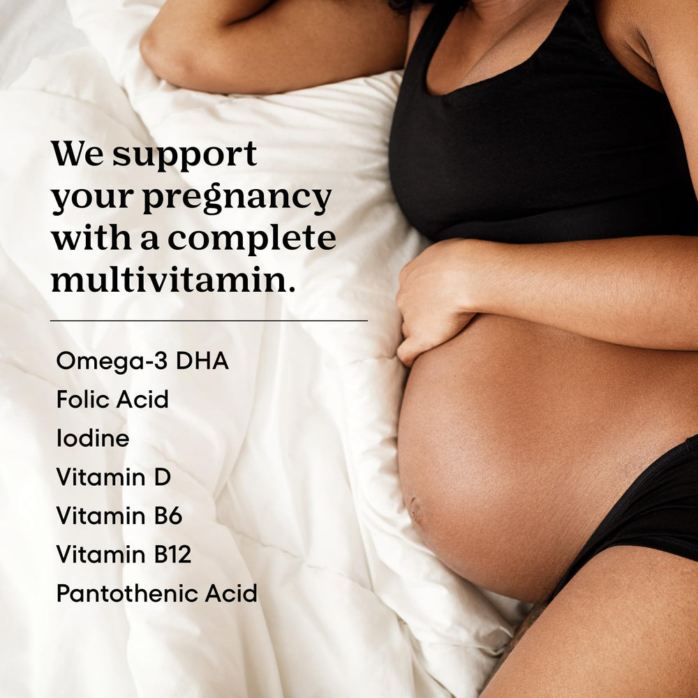 ONE A DAY two prenatal gummies held in hand illustrating chewable dosage