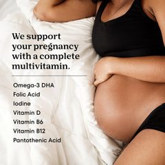 ONE A DAY two prenatal gummies held in hand illustrating chewable dosage