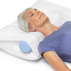 OPTP cervical roll in bed used under neck demonstrating improved sleeping posture