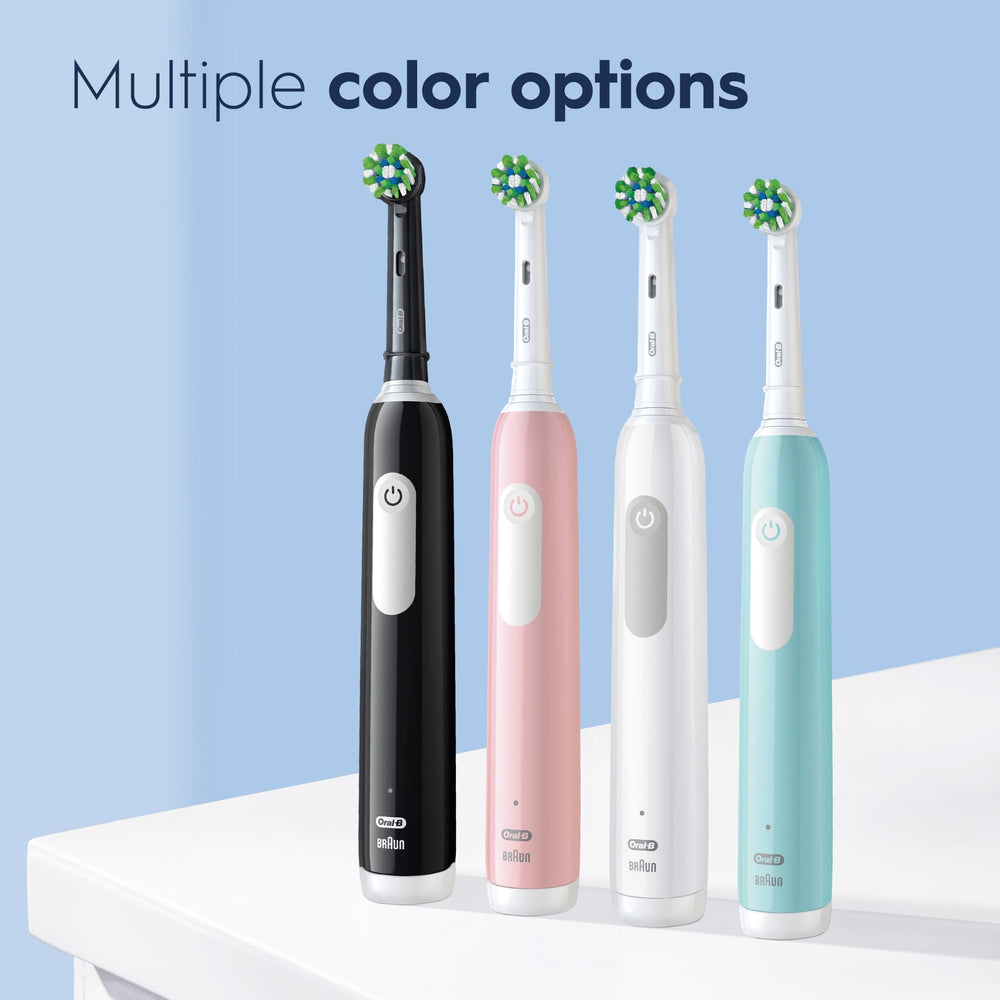 Oral-B Pro 1000 held in hand to show compact size and comfortable grip for daily use