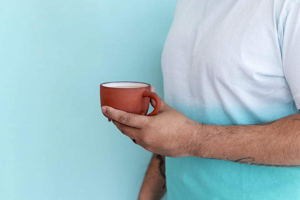 Oregon Chai pouring concentrate into measuring cup — precise mixing ease
