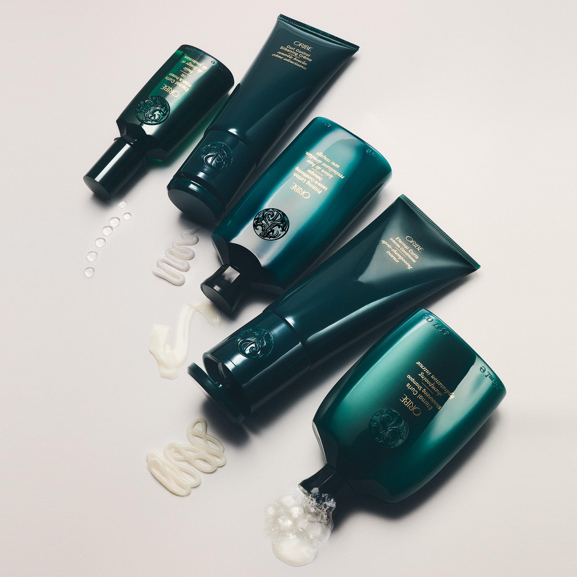 ORIBE bottle on bathroom shelf in lifestyle scene showing salon-quality benefit
