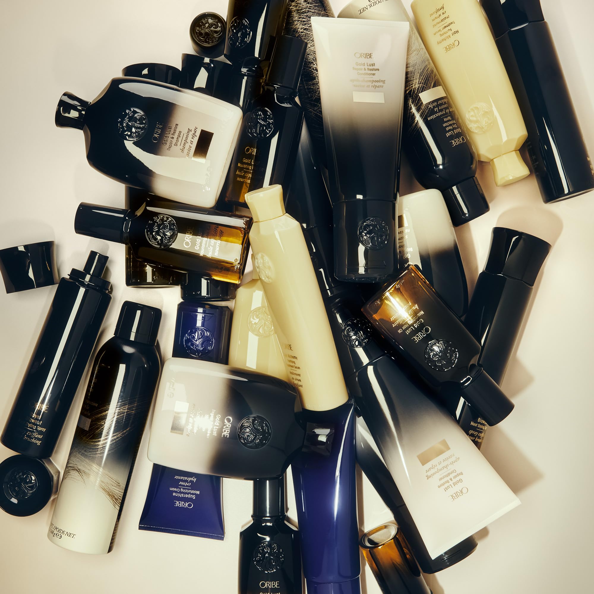 Oribe Gold Lust con icono solar indicando protección UV y mayor resistencia