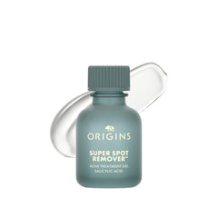 Origins frasco frontal mostrando diseño y aplicador para corrección puntual