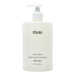 OUAI botella frontal mostrando diseño y volumen, aspecto premium
