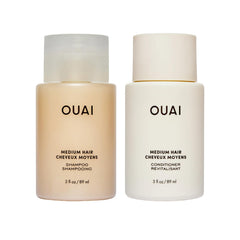 OUAI set de viaje frente mostrando champú y acondicionador, práctico para viajes