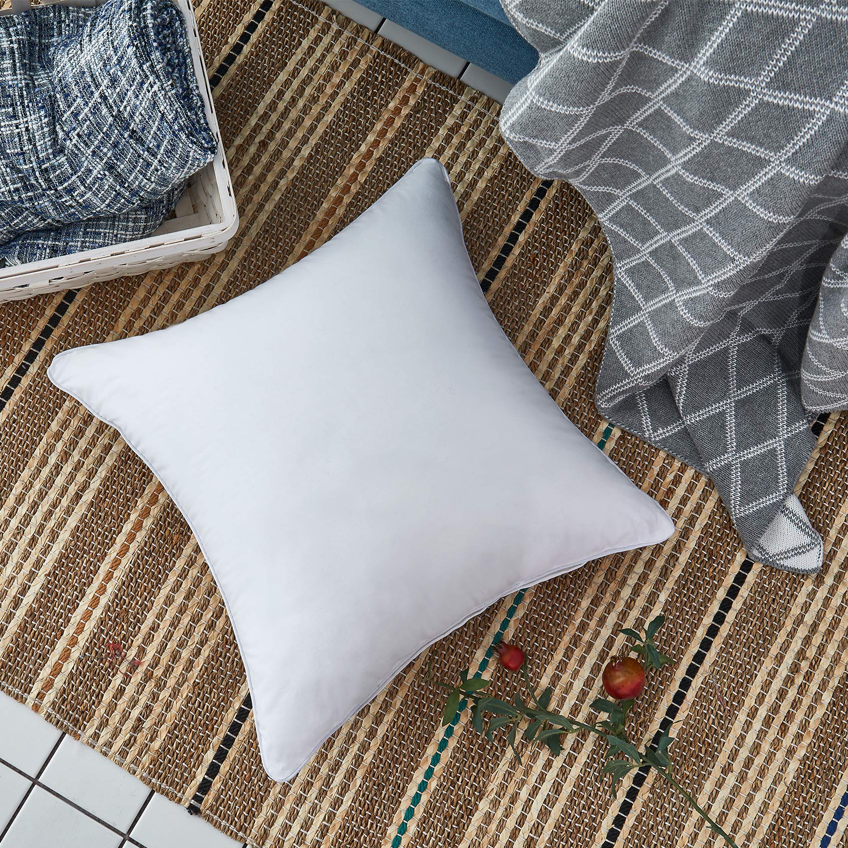 Oubonun inserts styled on a living room sofa adding polished, plump cushions