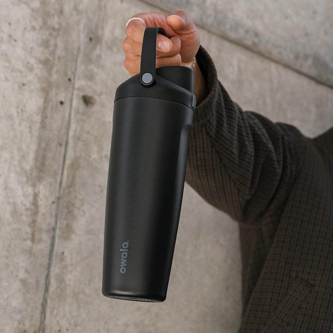 Owala FreeSip Sway outdoors on a picnic table showing durable insulated use on the go
