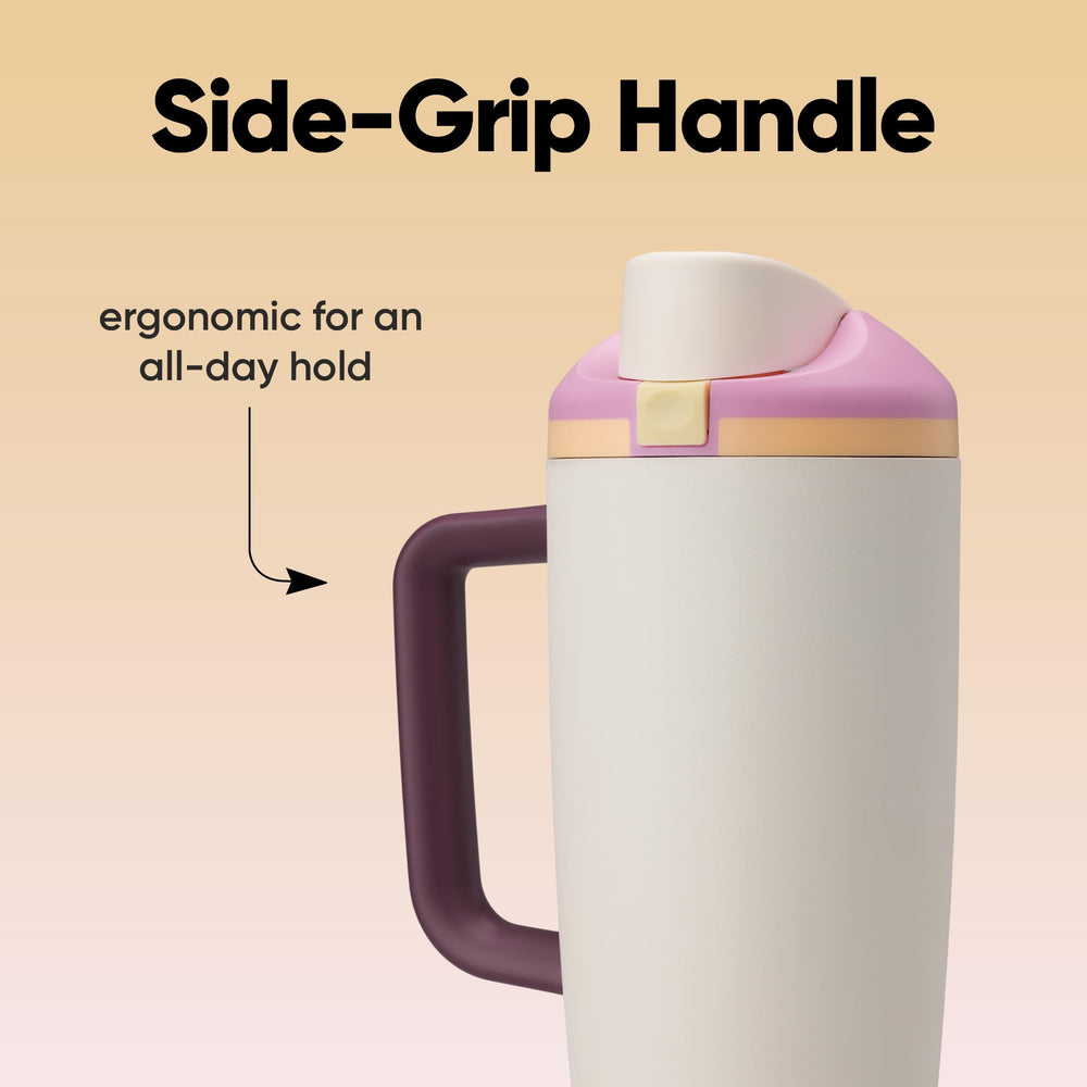 Owala FreeSip in a car cup holder showing contoured base keeps bottle secure while driving