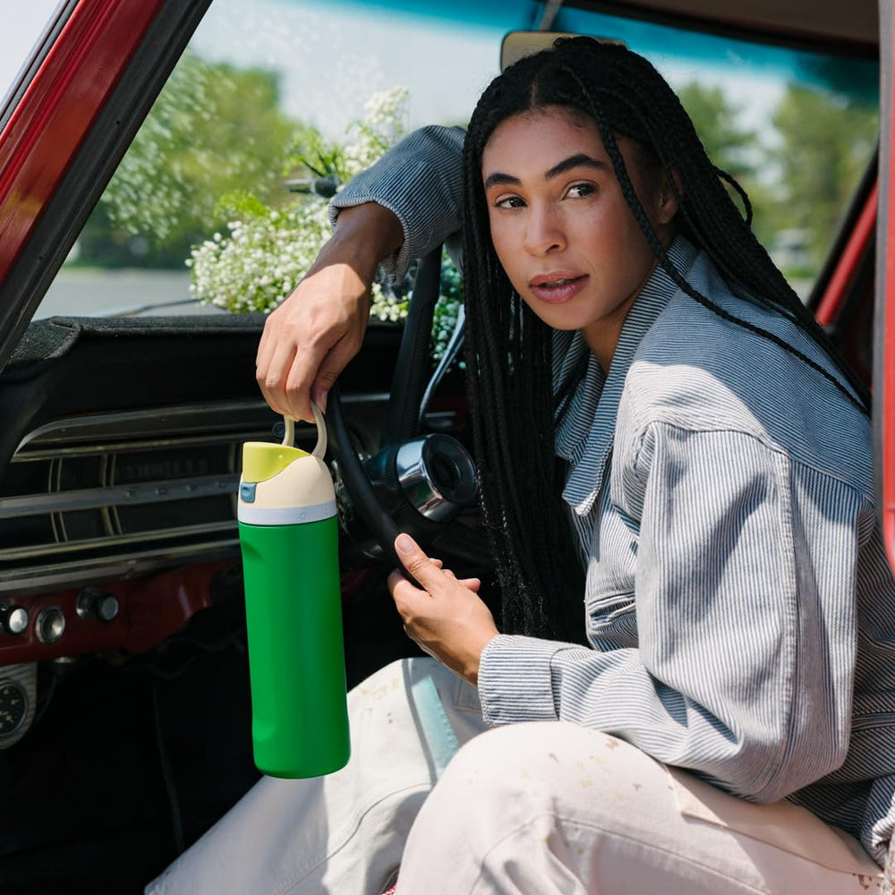 Owala FreeSip in outdoor setting being used for hydration during active lifestyle