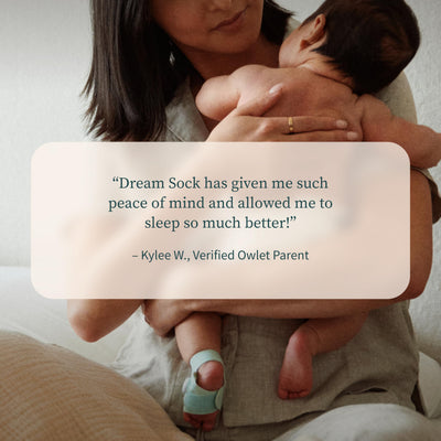 Family checking phone with Dream Sock showing connected monitoring for peace of mind