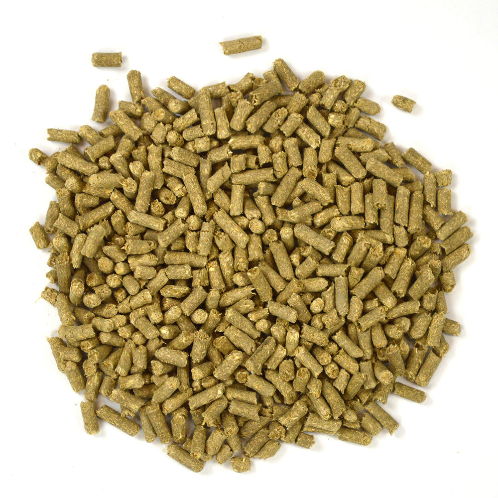 Oxbow Eco Straw pellets in compost bin illustrating compostable disposal benefit