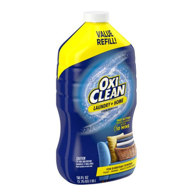 OxiClean botella colocada sobre lavadora lista para rellenar spray