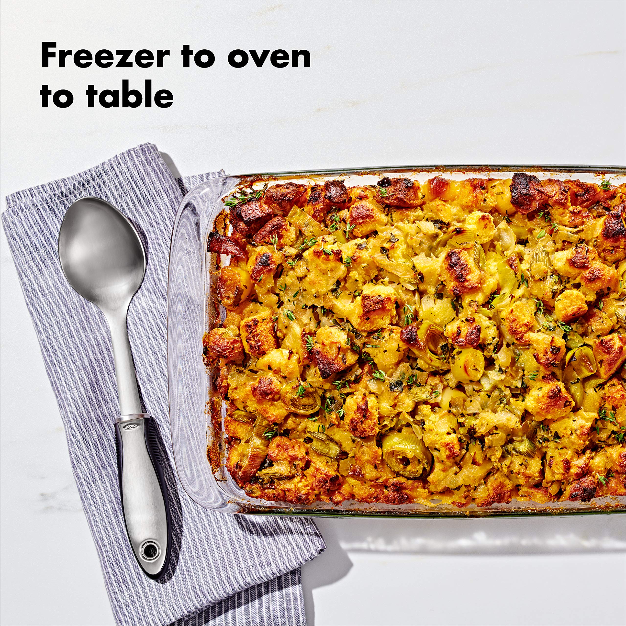 OXO side profile of 9x13 dish with slosh-proof lid for spill prevention