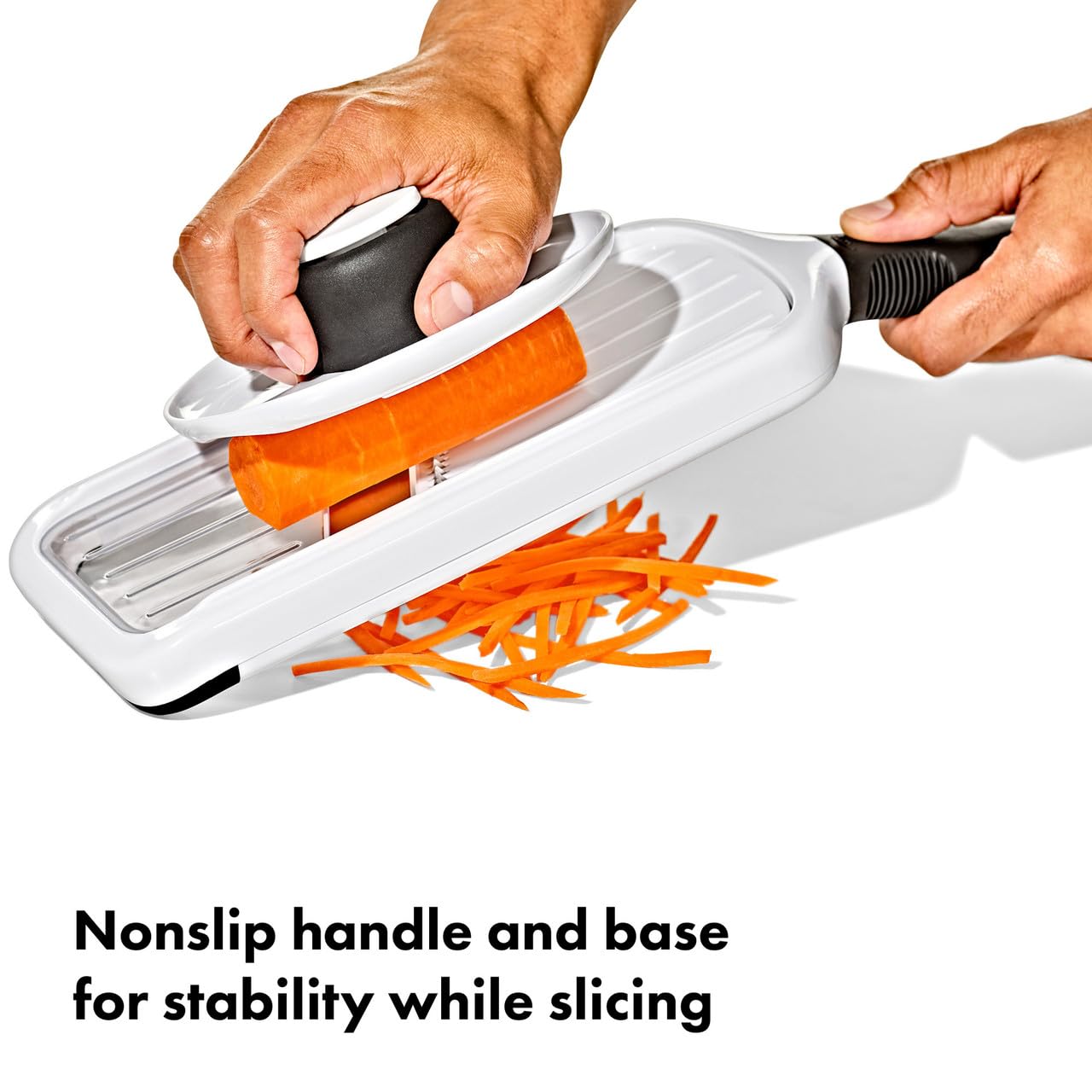 OXO mandoline stored with food holder under unit for tidy organization