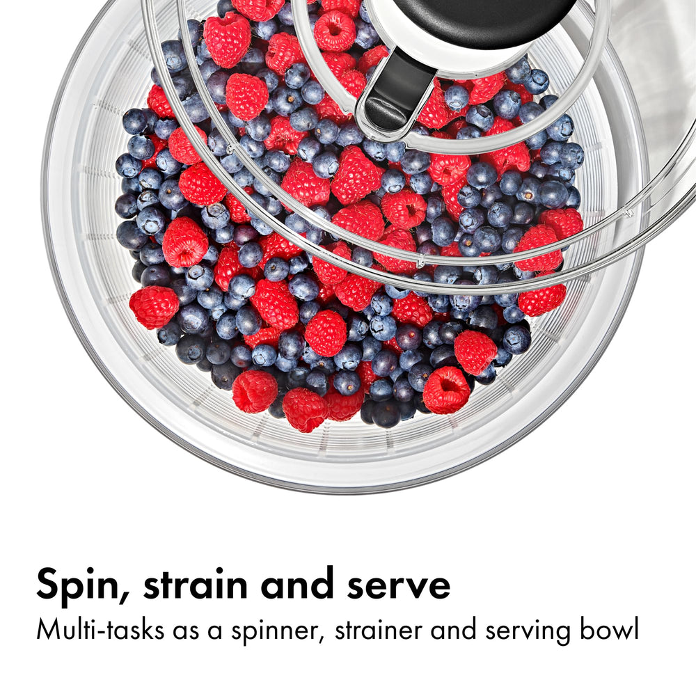 OXO Good Grips spinner in use rinsing and spinning lettuce for crisper salads