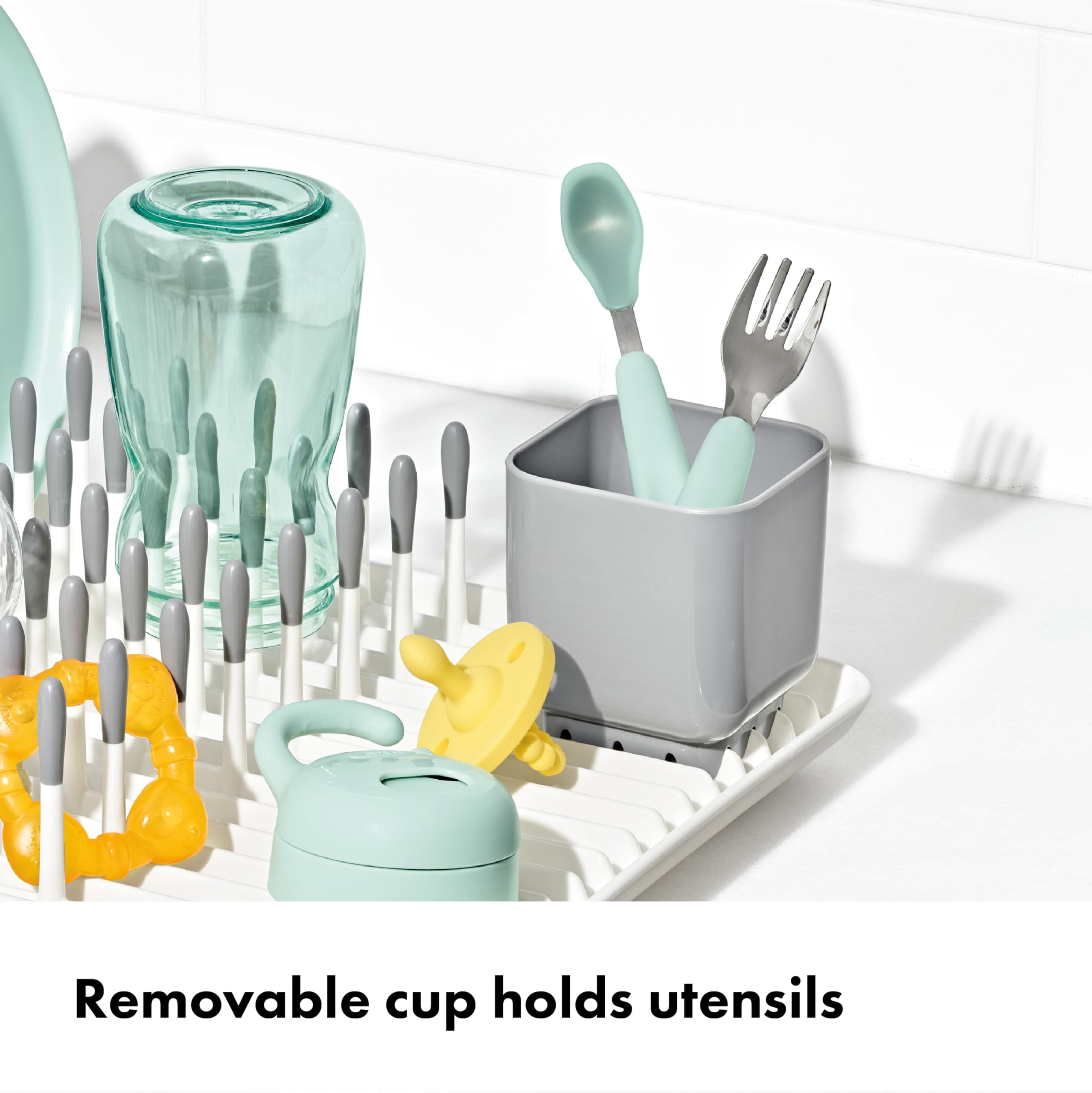 OXO Tot removable cup holding nipples and straws for contained organization