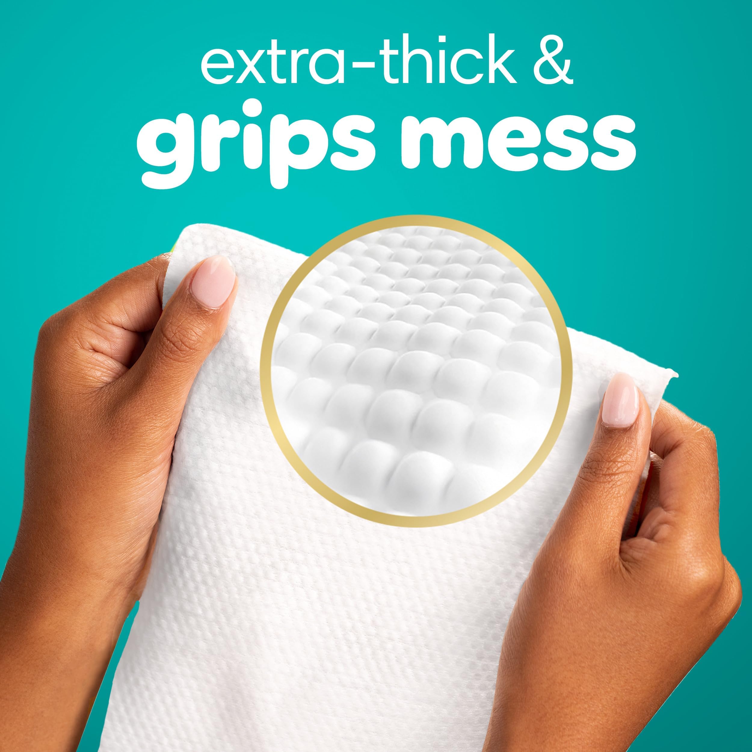 Pampers Ultraclean comparación de tamaño junto a una mano para escala