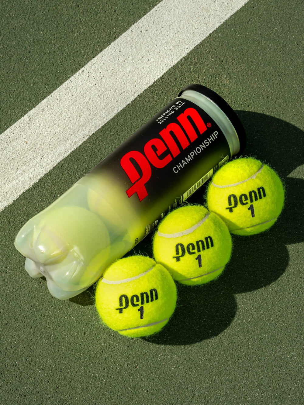 Penn three-ball can beside racket for scale and convenience benefit