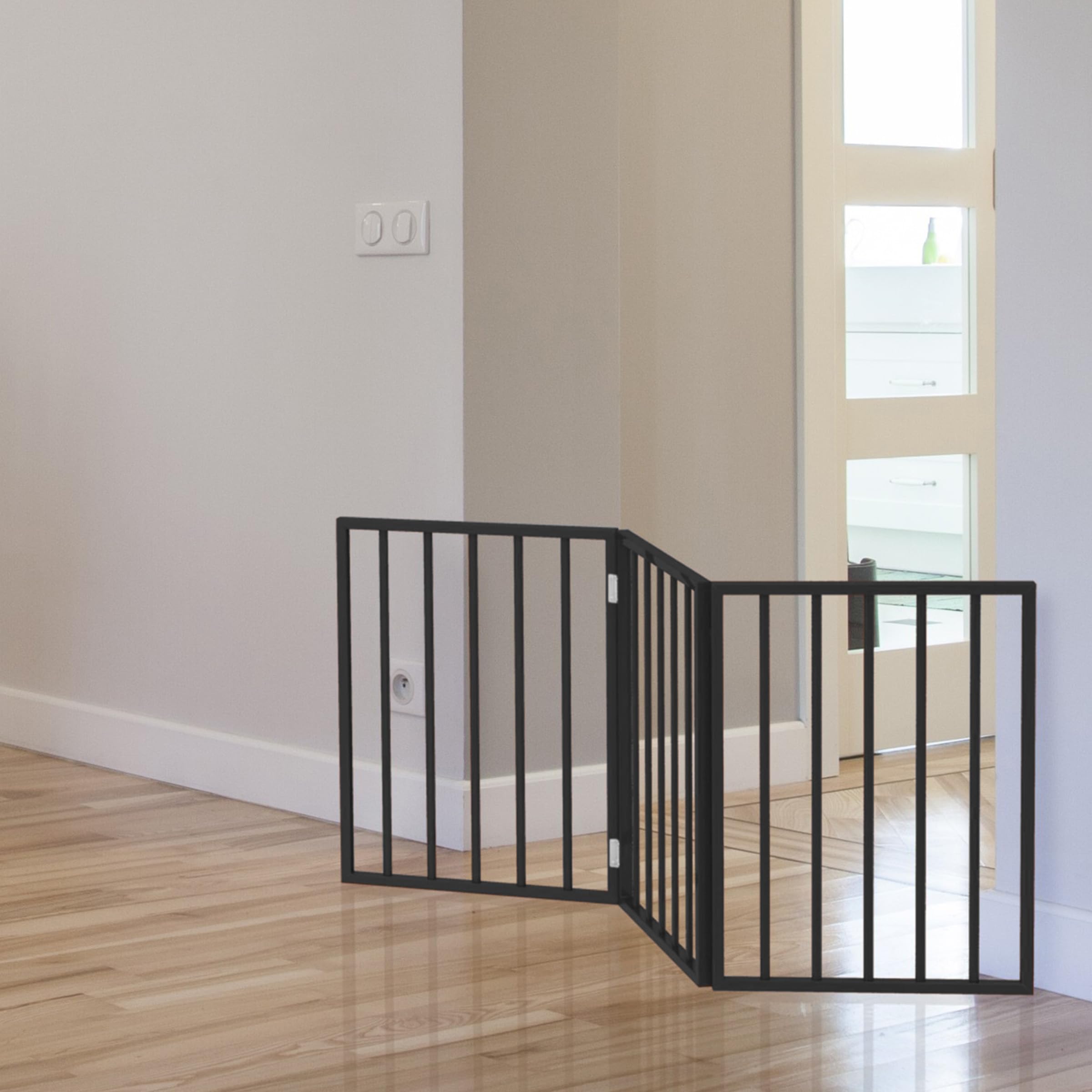 PETMAKER gate next to small dog showing scale and reliable containment benefit