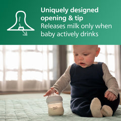 Philips Avent bottle held in adult hand showing ergonomic shape and easy grip benefit