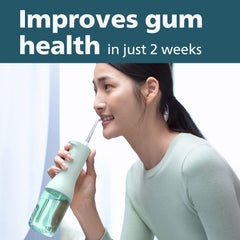 Philips Sonicare Standard tip in use between teeth removing trapped food for cleaner interdental spaces