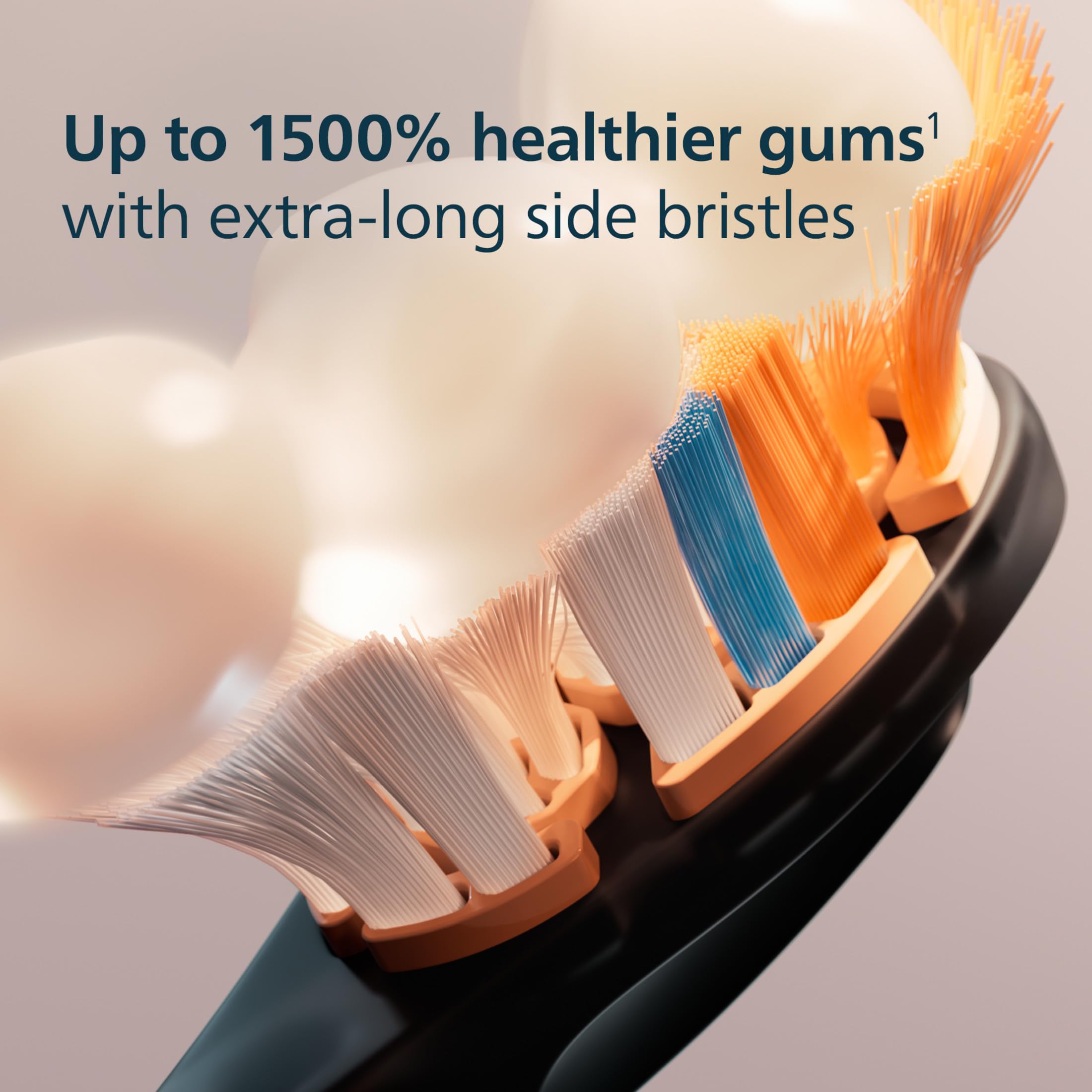Philips Sonicare head in use on a tooth model illustrating plaque removal