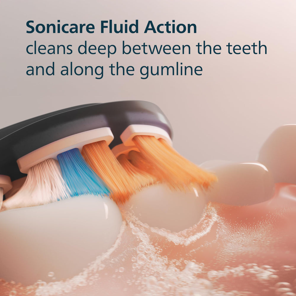 Philips Sonicare brush head beside a coin showing compact size and fit