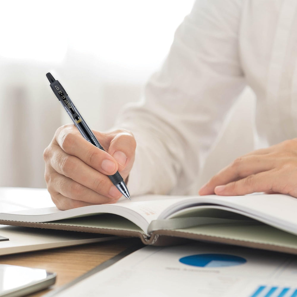 PILOT G2 pen writing on notebook at desk showing smooth gel flow for productivity