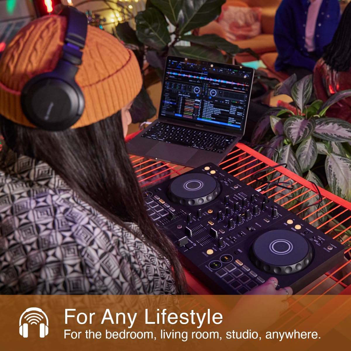 Pioneer DJ DDJ-FLX4 in hand showing compact size for travel-friendly DJing and gig readiness