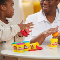 Play‑Doh latas abiertas mostrando colores vivos, inspiración creativa
