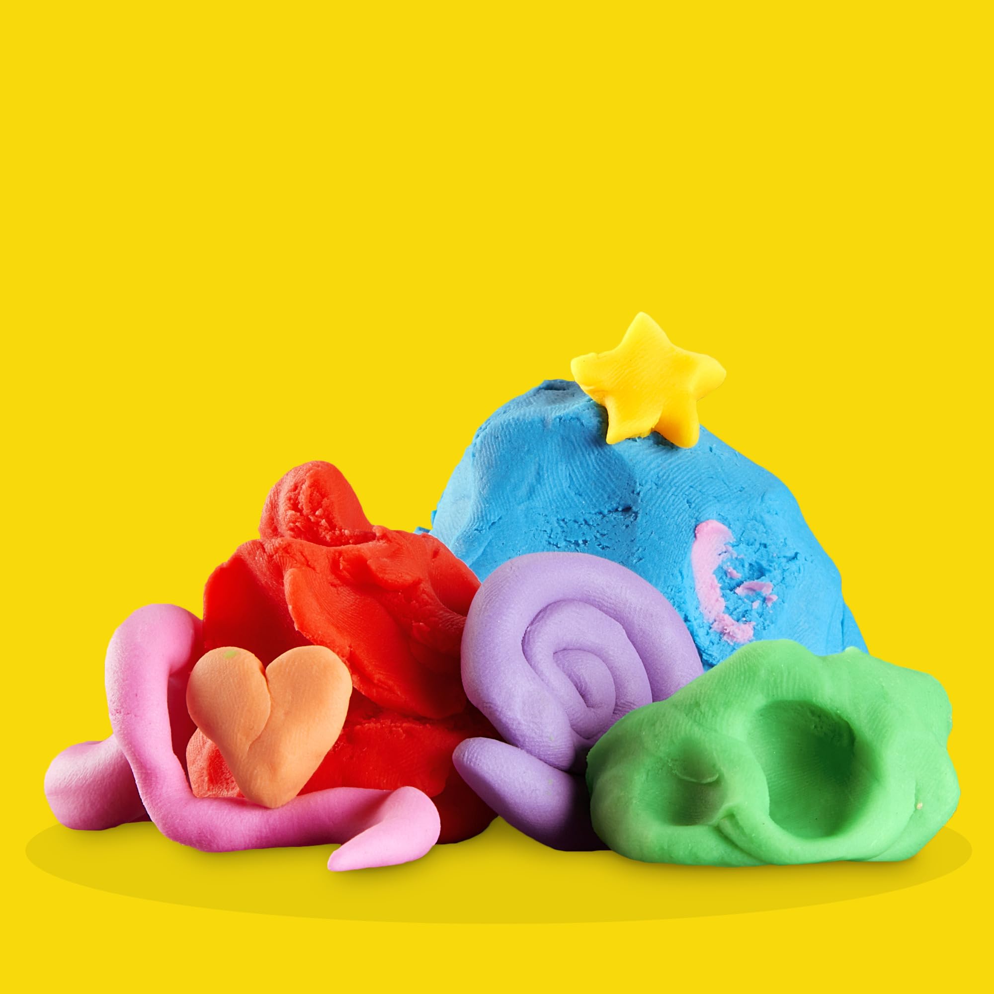 Play-Doh bote junto a una regla para comparar tamaño práctico