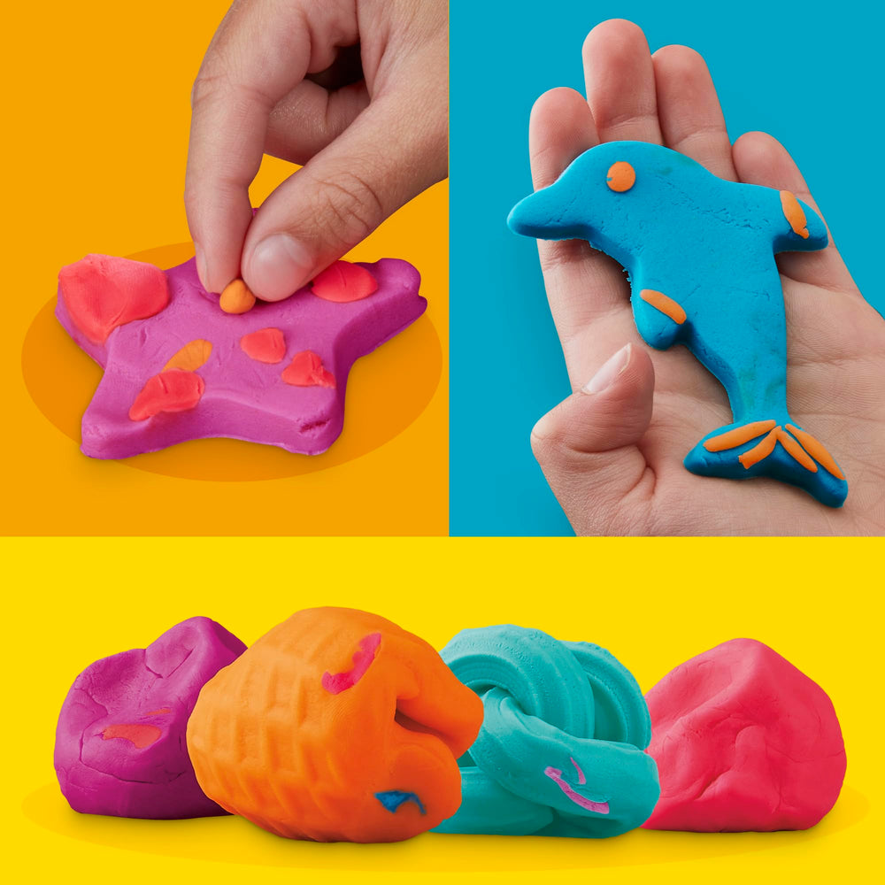 Play-Doh niños en clase usando botes durante actividad grupal