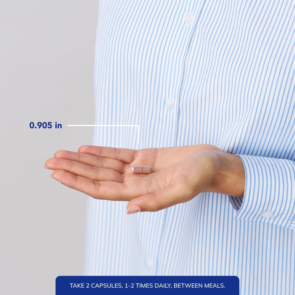 Pure Encapsulations capsule beside a coin for size and ease of swallowing