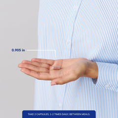Pure Encapsulations capsule beside a coin for size and ease of swallowing