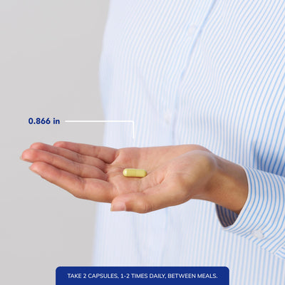 Pure Encapsulations capsules held in hand to show scale and convenient dosing