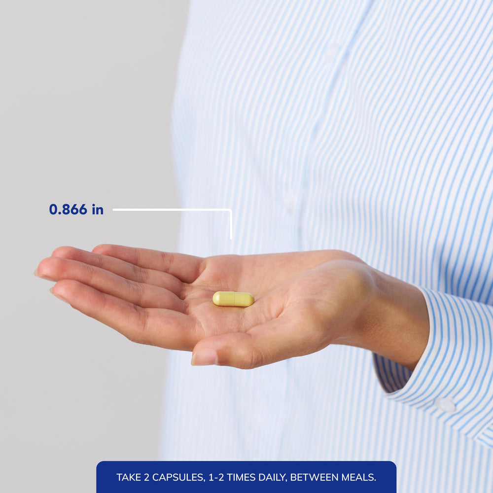 Pure Encapsulations capsules held in hand to show scale and convenient dosing