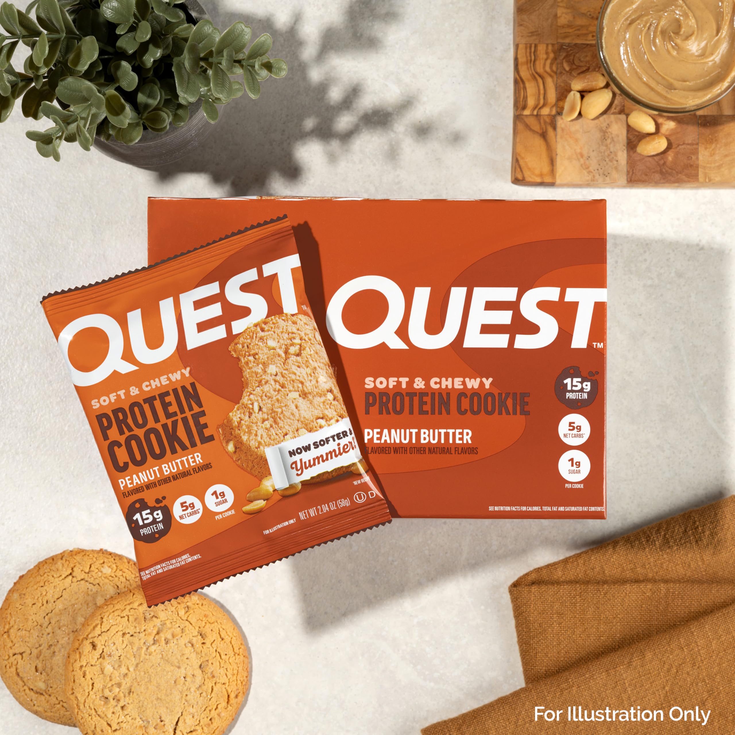 Quest cookie beside a water bottle and notebook for workplace refuel