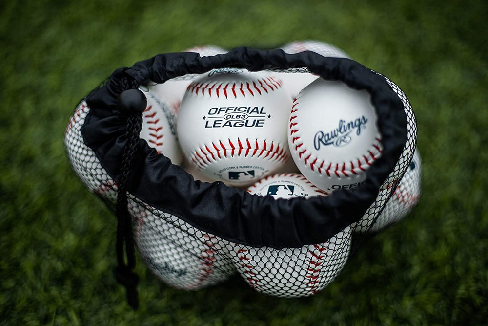 Rawlings baseball held in a youth hand showing size and scale