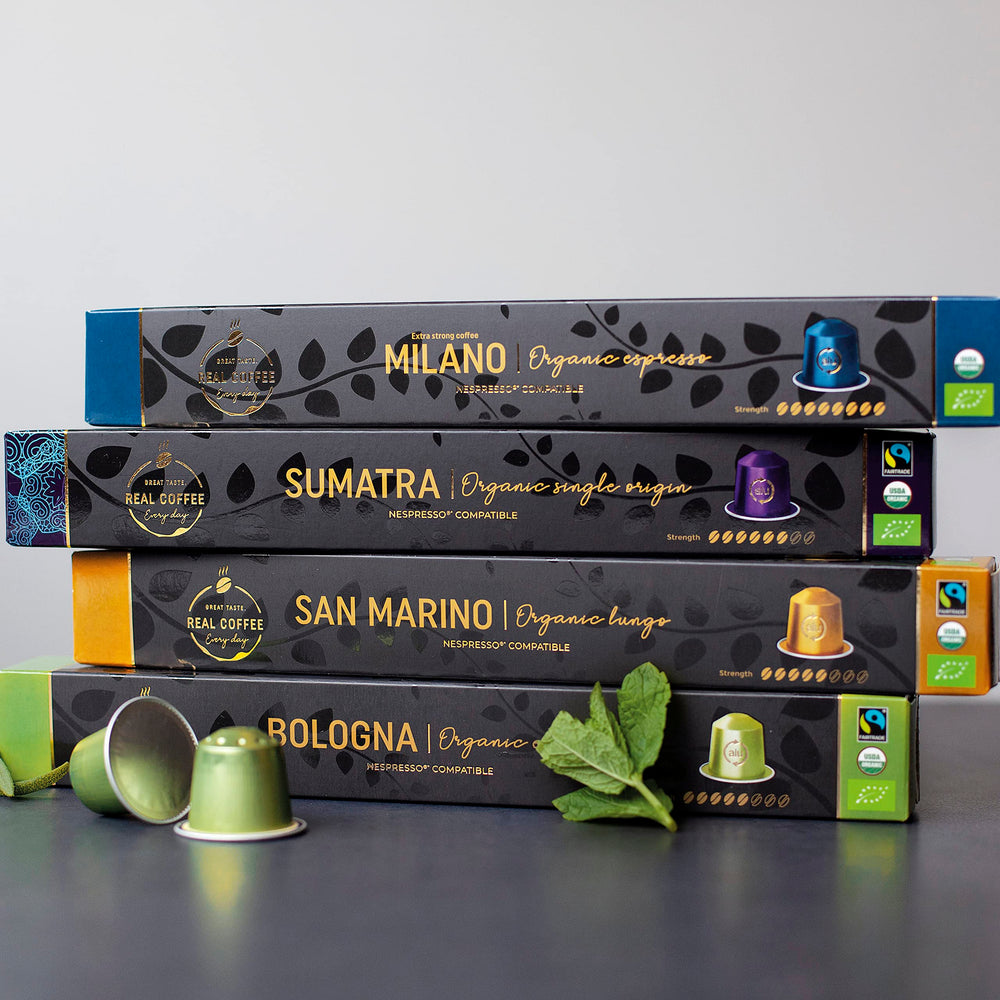 Cápsula REAL COFFEE insertada en máquina Nespresso Original, muestra uso sencillo y extracción de espresso