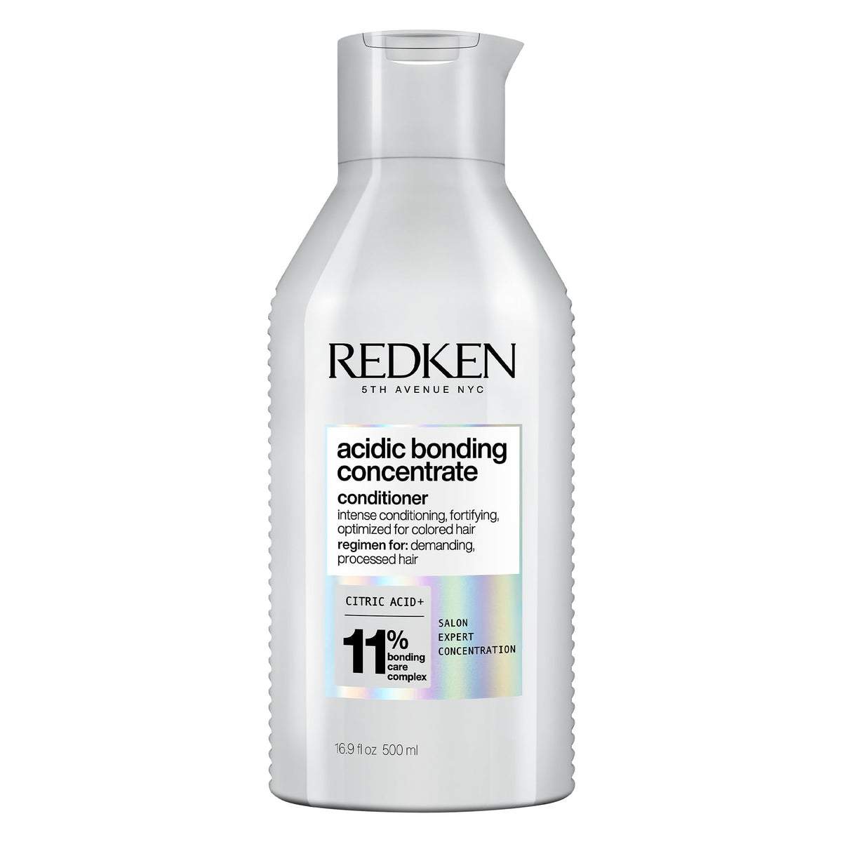 Redken bote frontal mostrando etiqueta y beneficio de reparación