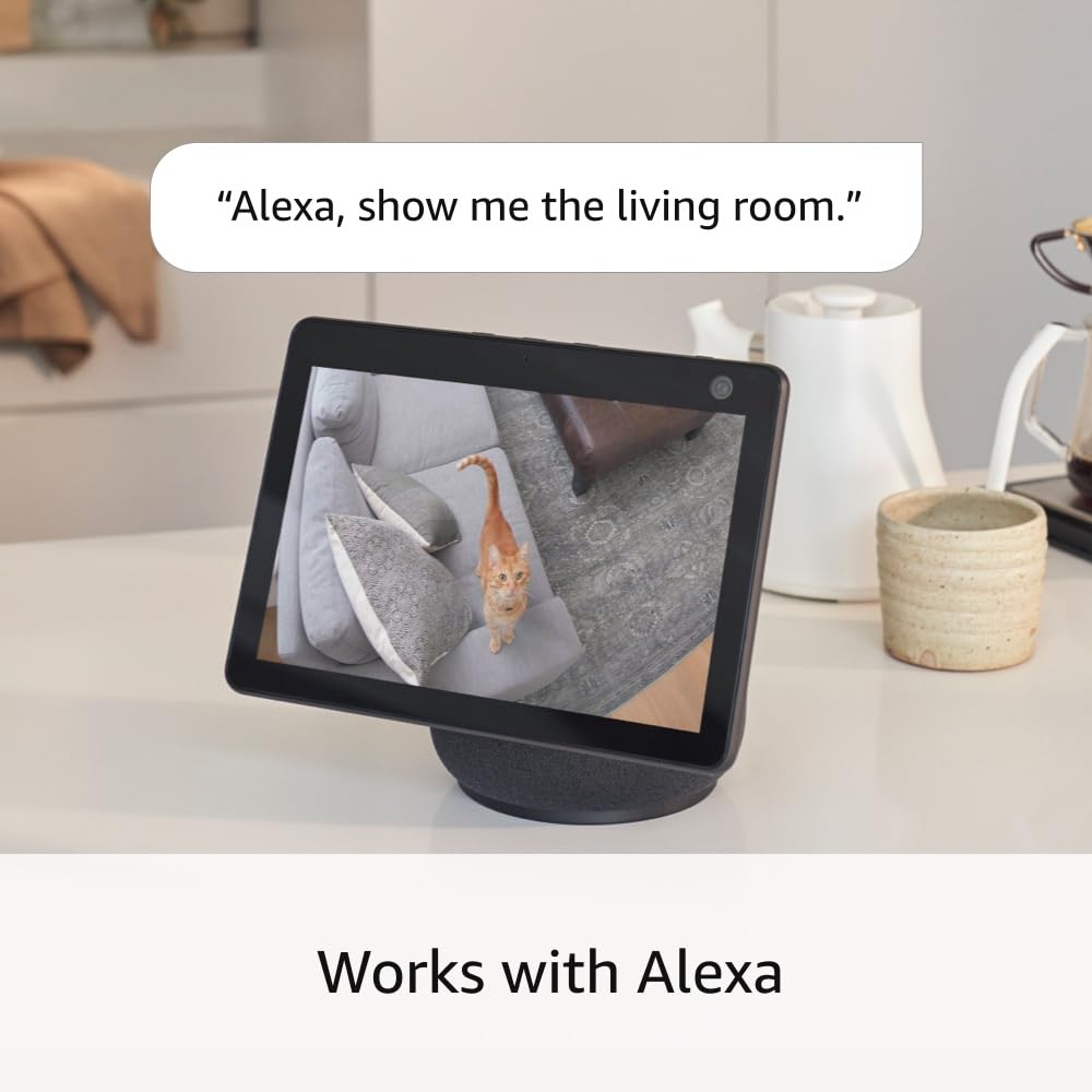 Ring Pan-Tilt Indoor Cam held in hands showing size scale and effortless installation benefit
