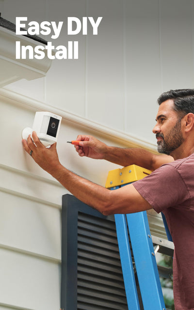 Ring Spotlight Cam Plus held in hand showing compact size and easy installation