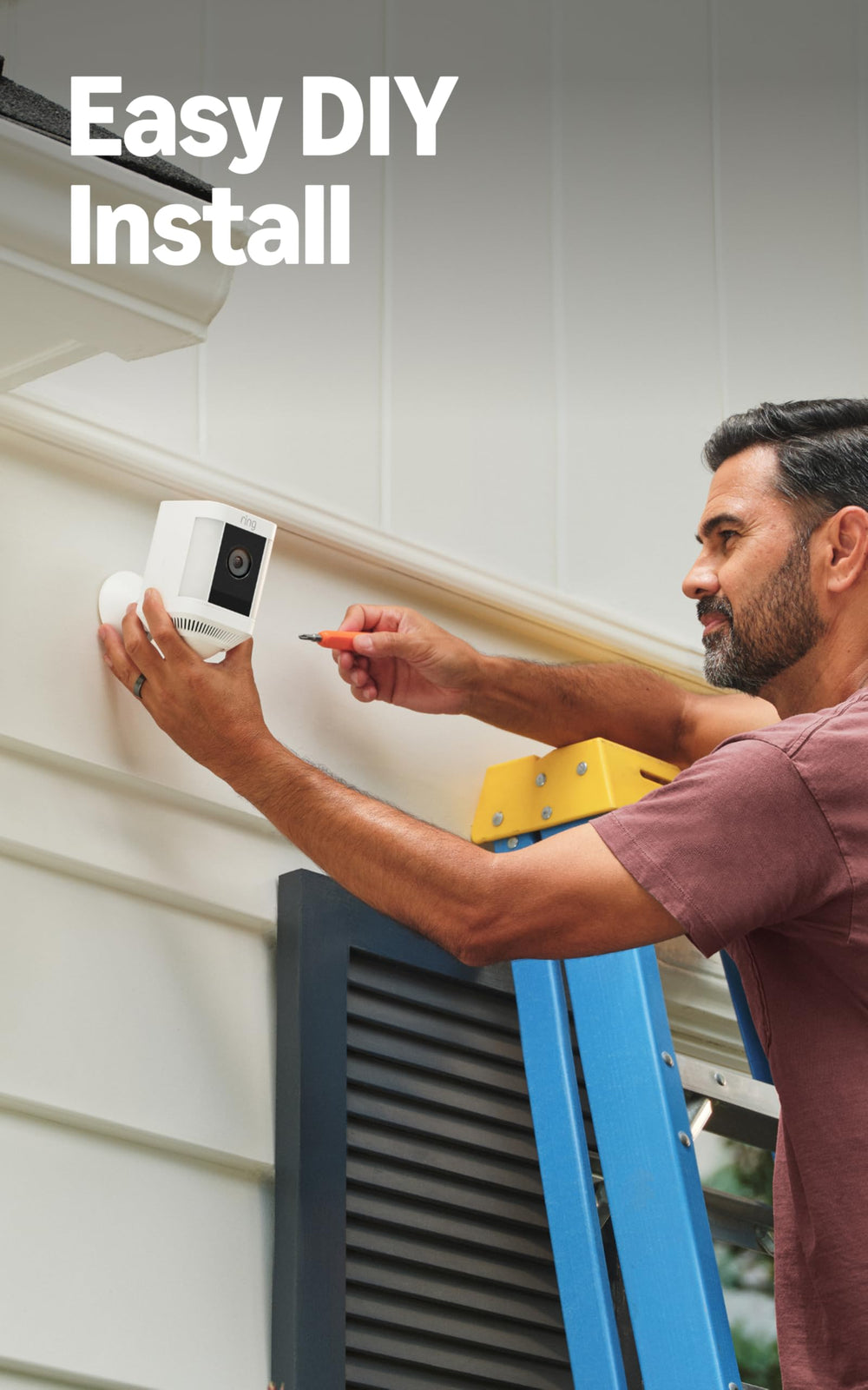 Ring Spotlight Cam Plus held in hand showing compact size and easy installation